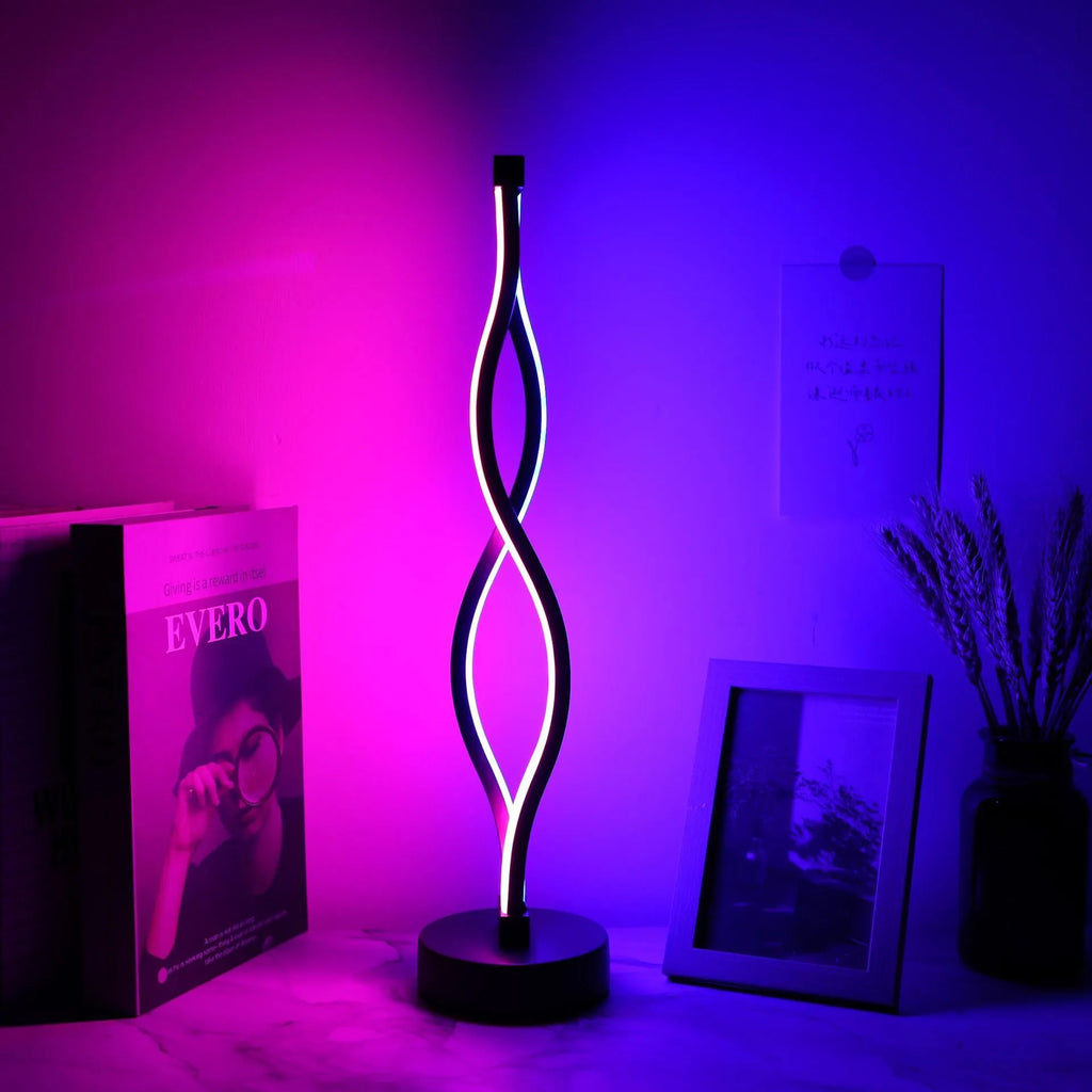 Black aluminium desk lamp with touch dimming buttons in blue and pink, showing three colour temperature modes