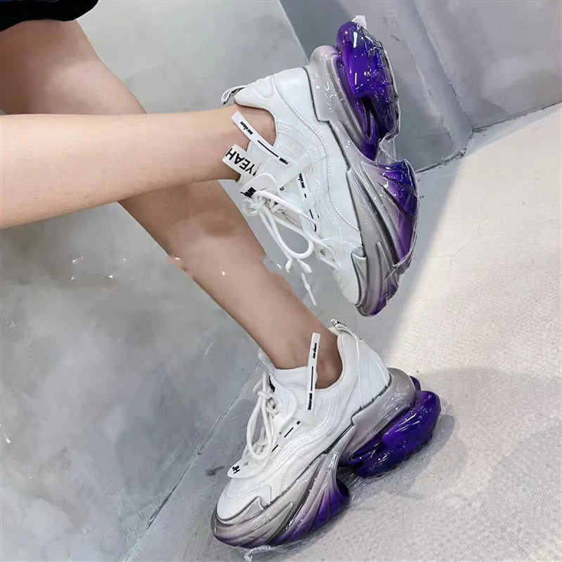 Women's green leather sports shoes with thick soles and cross-tie lacing on a white background.
