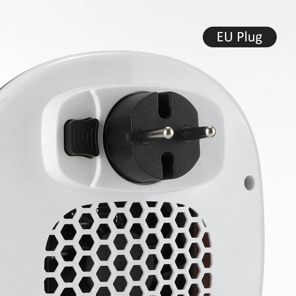 White ceramic heating electric hot air blower heater with remote control on wooden surface
