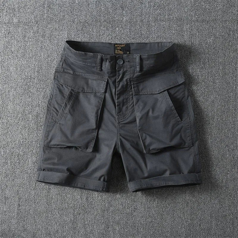 Men's army green cotton cargo shorts with multiple pockets, shown in a straight-leg summer street style.