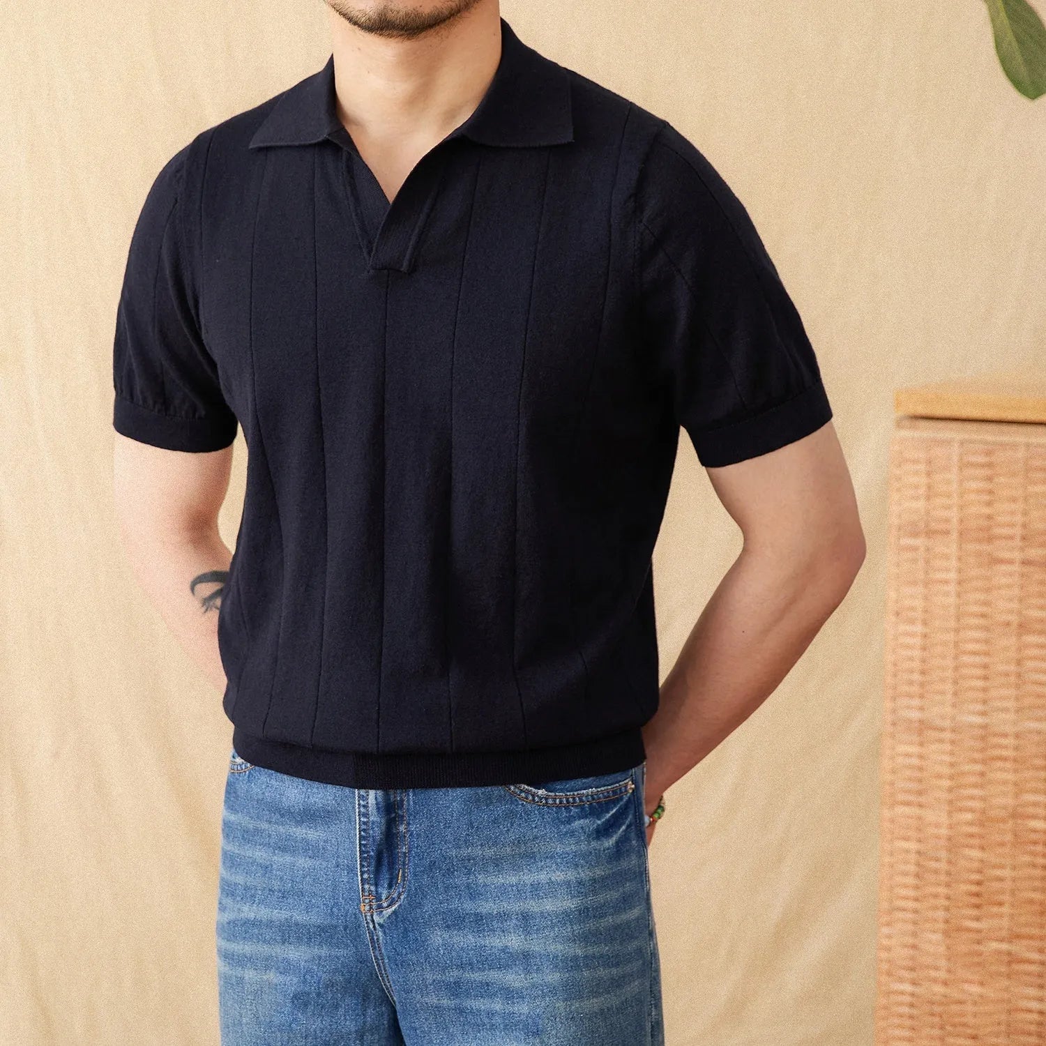 Men's purple sunken stripe knitted polo shirt with a seagull collar on a hanger.