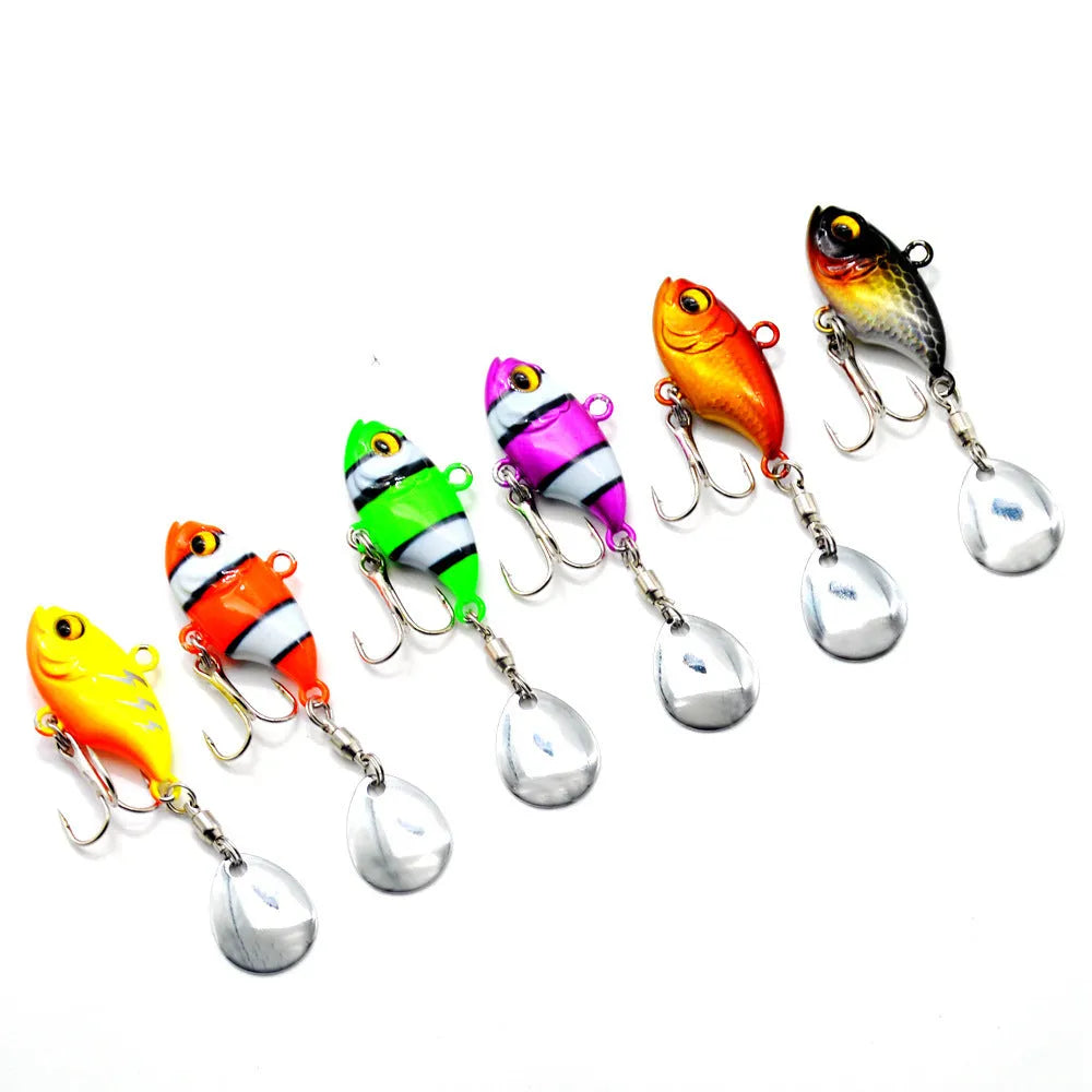 Metal sea fishing lure with rotating sequins shown in multiple colour options including zebra orange and gold.