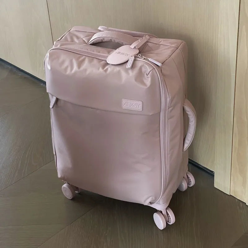 Ultra-light waterproof Oxford cloth suitcase with universal wheels in bluestone green colour.