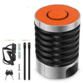 Portable black and black-orange bicycle folding lock made from zinc alloy and steel on a plain background.