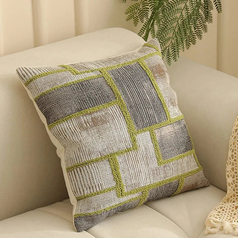 Jacquard floral pattern cushion cover in a retro colour, 45cm square, on a sofa.