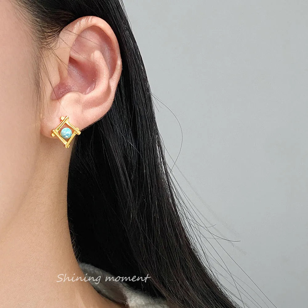 Geometric cross stud earrings in sterling silver with gold or silver plating options