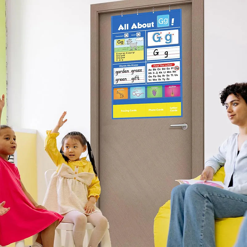 Alphabet learning sleeve chart with word cards, letter cards, and picture cards laid out for play.