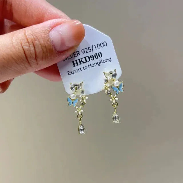 Women's geometric alloy ear clips with rhinestone decoration, star motifs, heart elements, and tassel details
