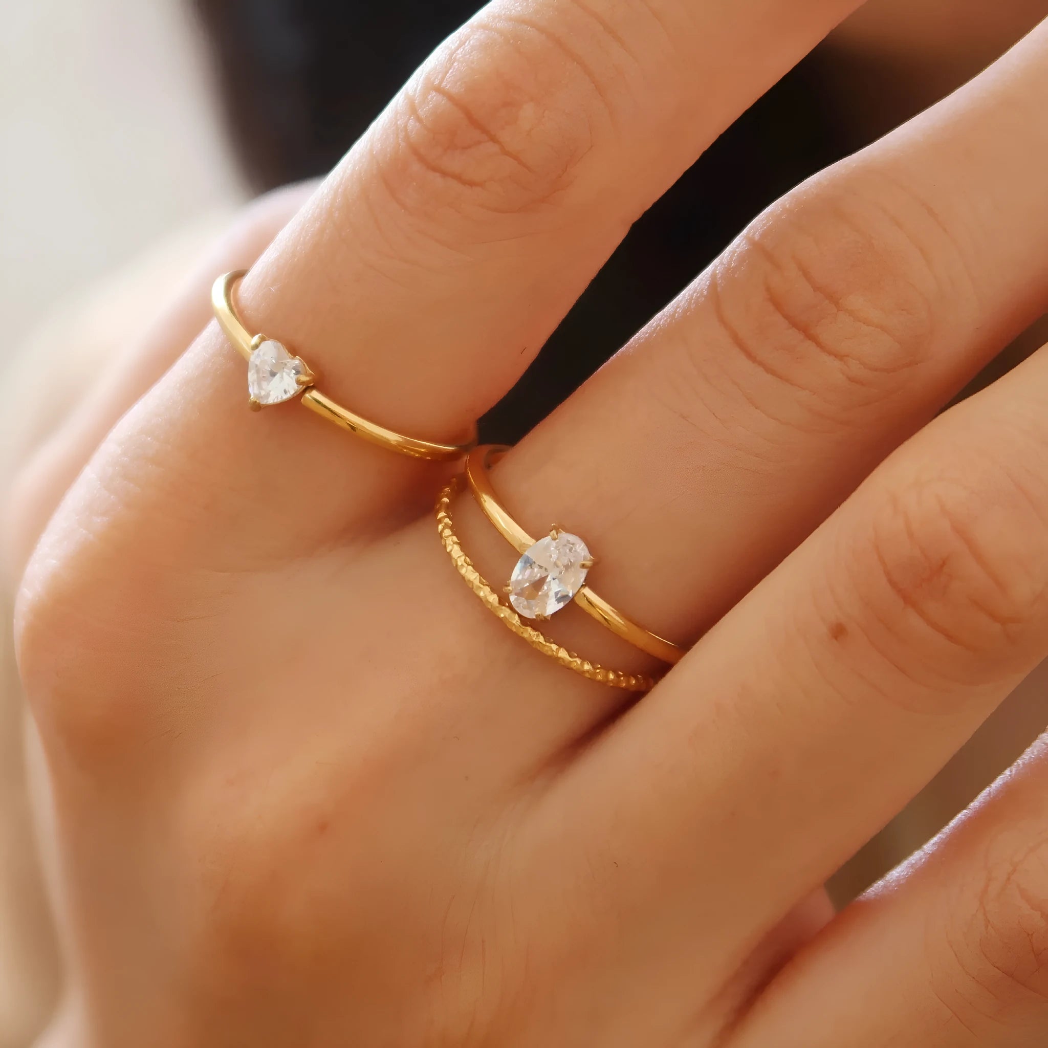Golden electroplated stainless steel ring with love heart or oval design for women in sizes 6, 7 and 8