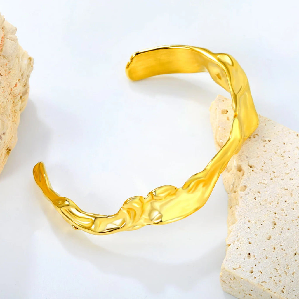 Minimalist stainless steel alloy bracelet in silver, gold, and rose gold colour options on a wrist.
