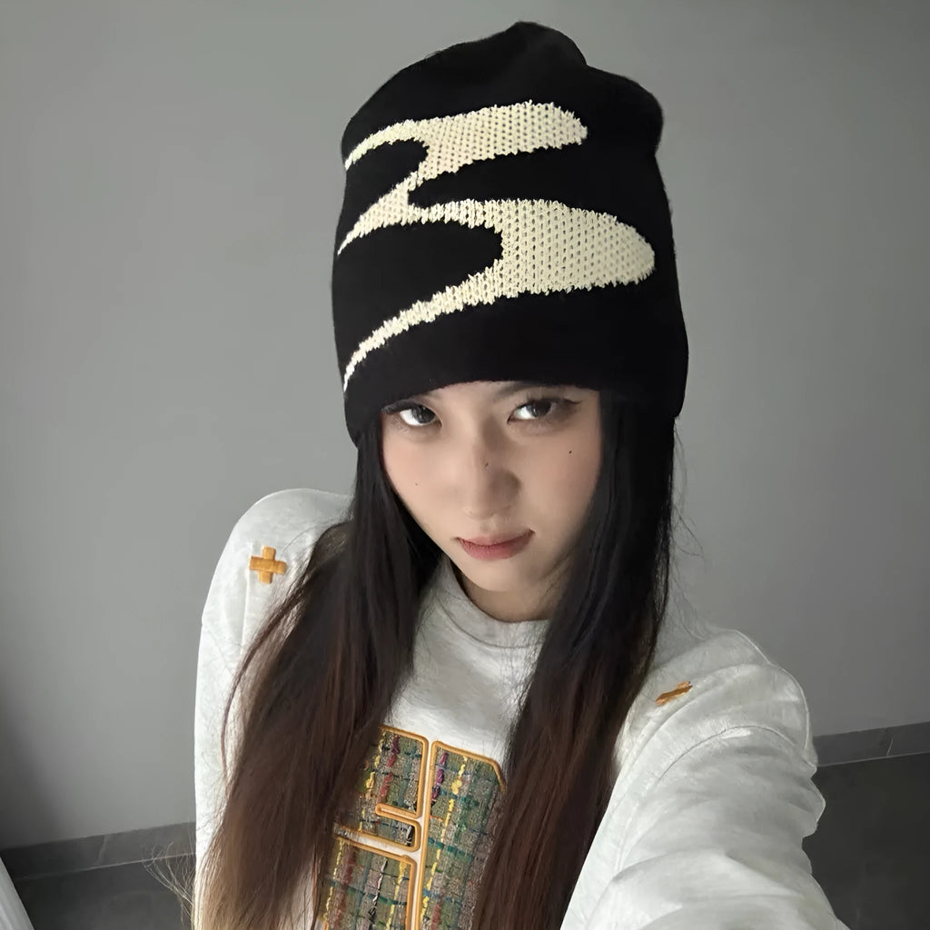 A black knitted acrylic beanie hat for men and women, size M for winter.