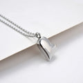 Silver stainless steel curved peach heart pendant necklace on a chain with extension