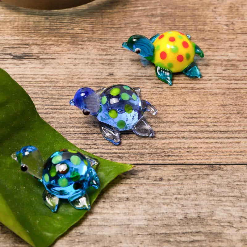 Geometric glass turtle desktop ornament in modern simplicity style on a wooden surface.