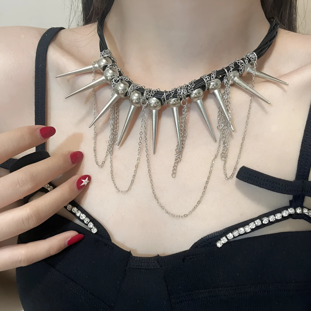Women's casual leather necklace with round beads, a winding tassel, and decorative rivet details in an electroplated finish.