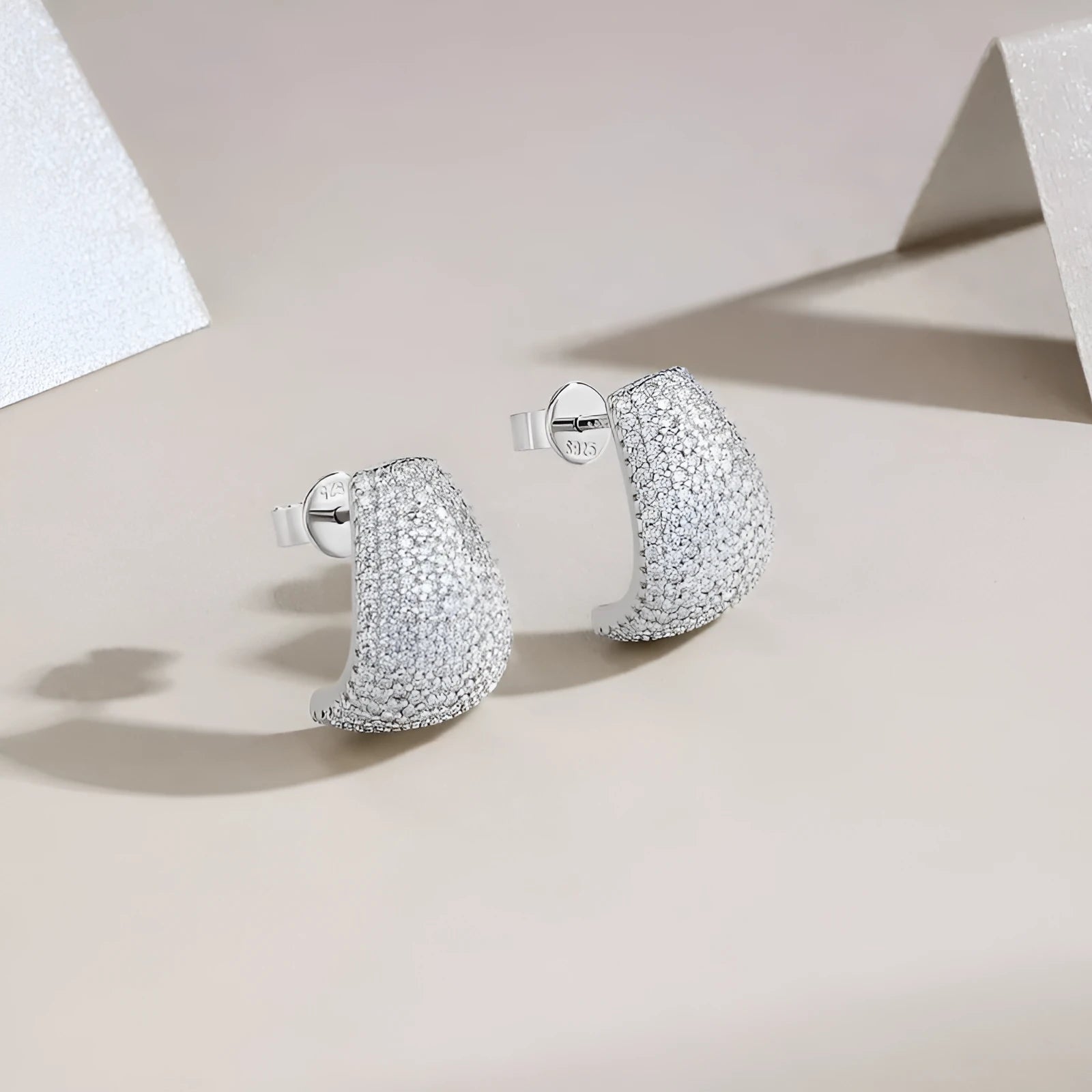 Geometric S925 sterling silver stud earrings with D-E colour moissanite stones.