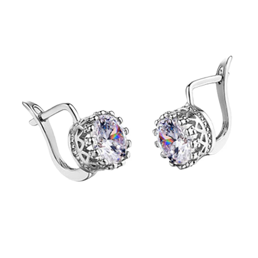 A pair of crown-shaped clip-on earrings for women in a rose gold or white gold colour finish.