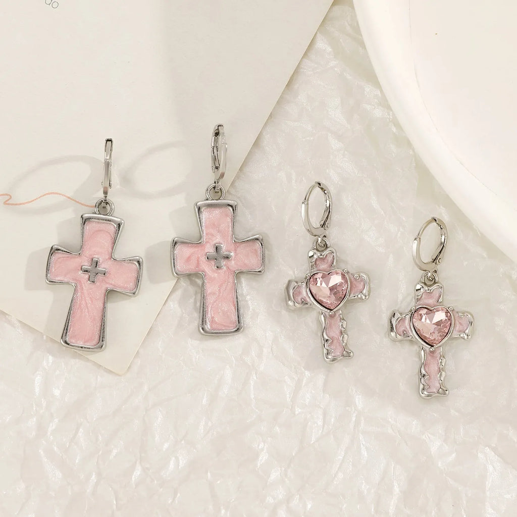 Women's alloy cross crystal earrings in five designs: white cross, peach heart, black cat, antique silver star.