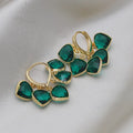 Korean style women's green heart ear clip earrings with alloy inlay gemstone.