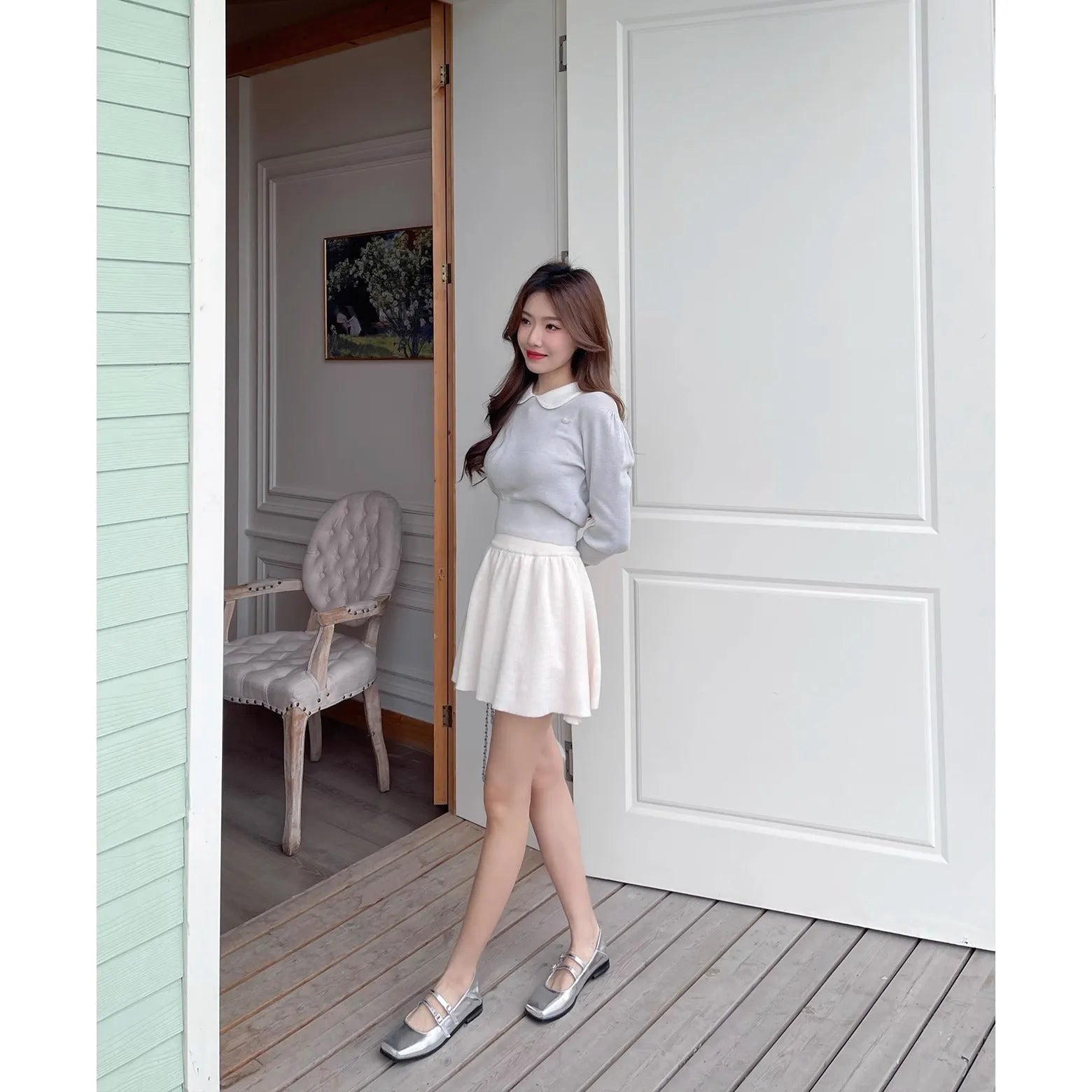 Women's silver genuine leather Mary Jane flats with a cross buckle strap and round toe.