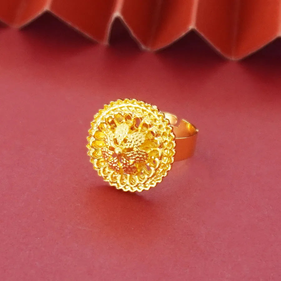 Gold-plated three-piece jewellery suit with landscape Middle East flower designs showing earrings, ring and pendant necklace