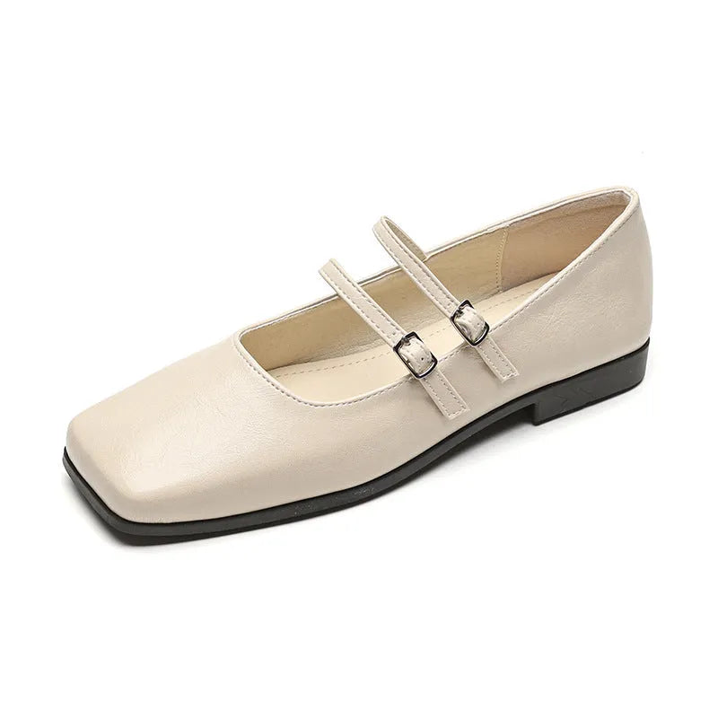 Women's silver genuine leather Mary Jane flats with a cross buckle strap and round toe.