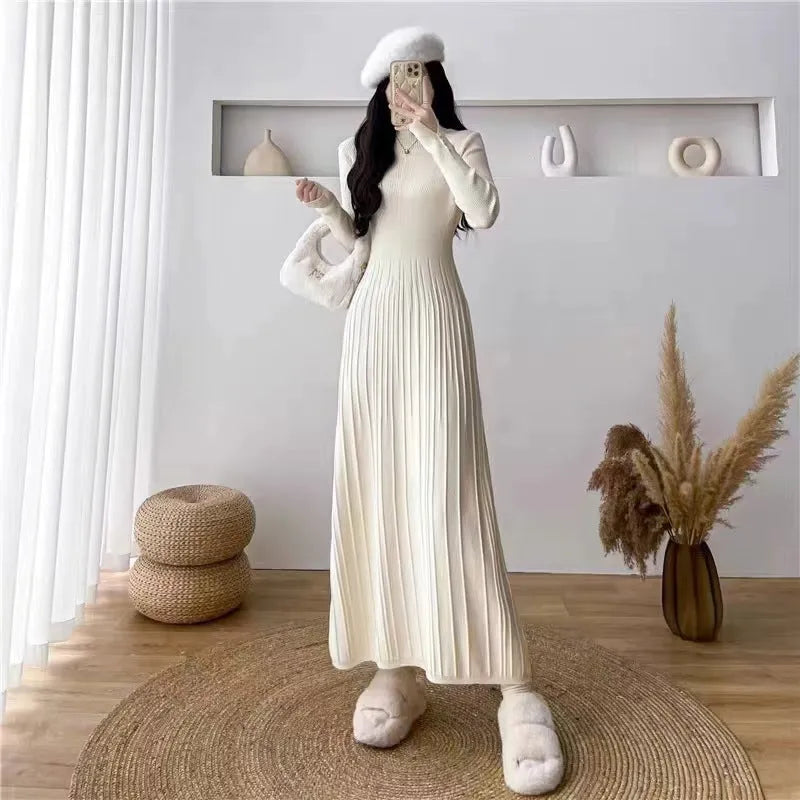 Women's high waist A-line midi skirt in a wool blend knit fabric, shown in milky white colour.