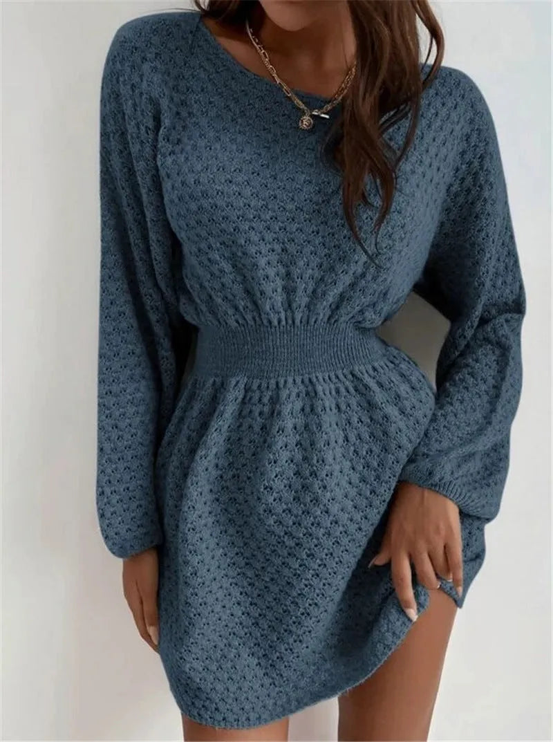 Blue women's knitted dress with French round neck, fitted waist, and crocheted flower details