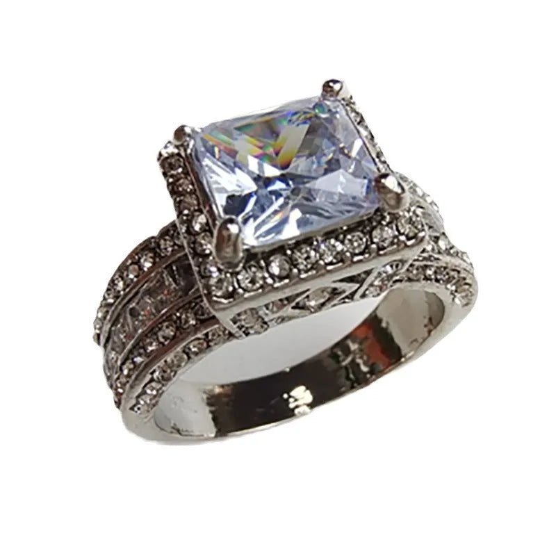 Geometric women's alloy ring in gold tone or white electroplated finish on a size guide showing UK sizes 5-13.