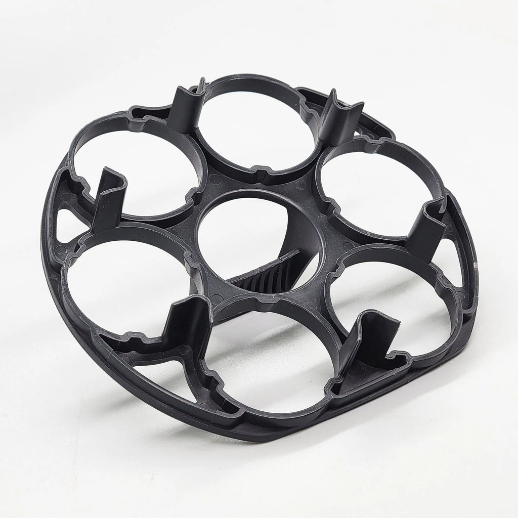 Black plastic egg holder rack with retainer for kitchen storage.