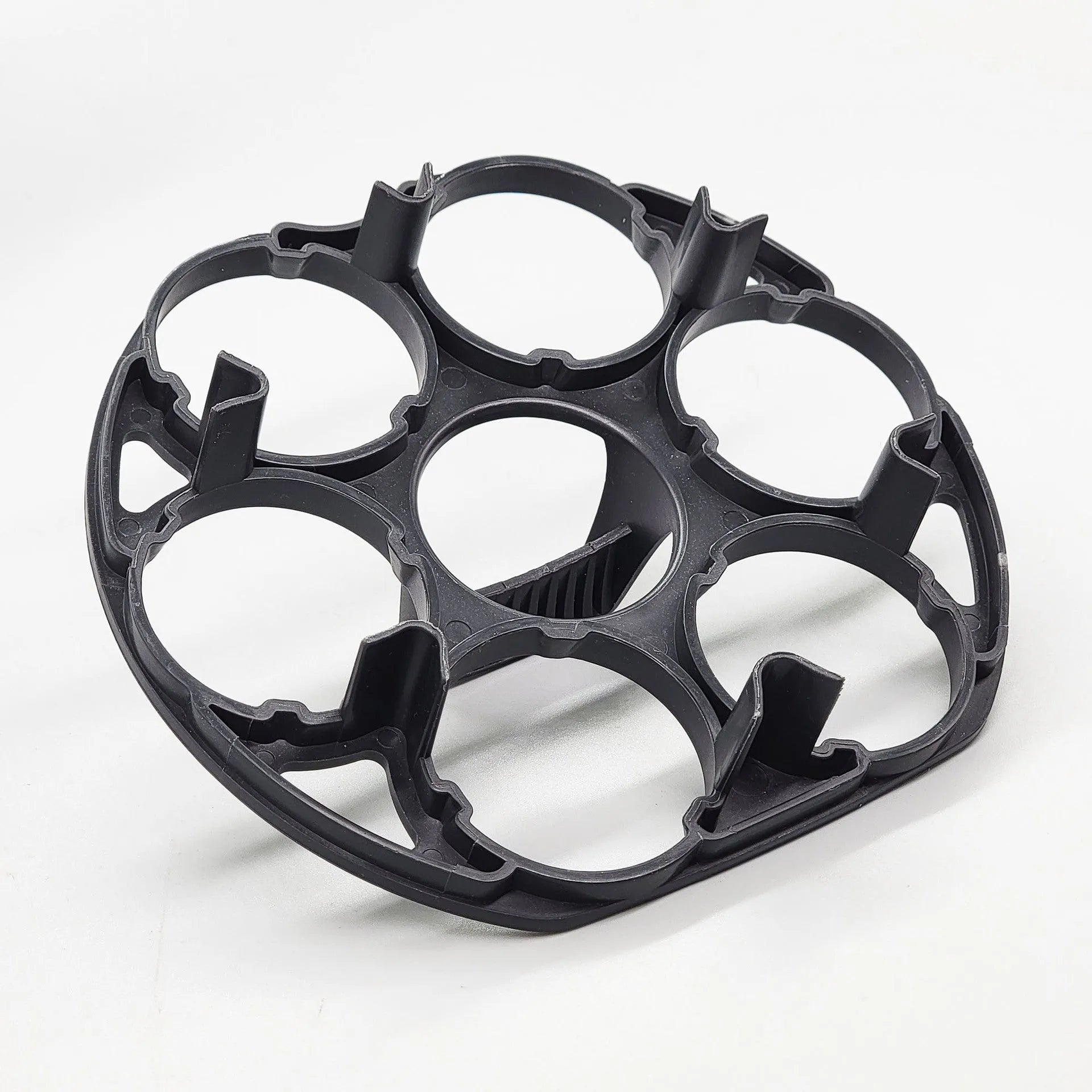 Black plastic egg holder rack with retainer for kitchen storage.