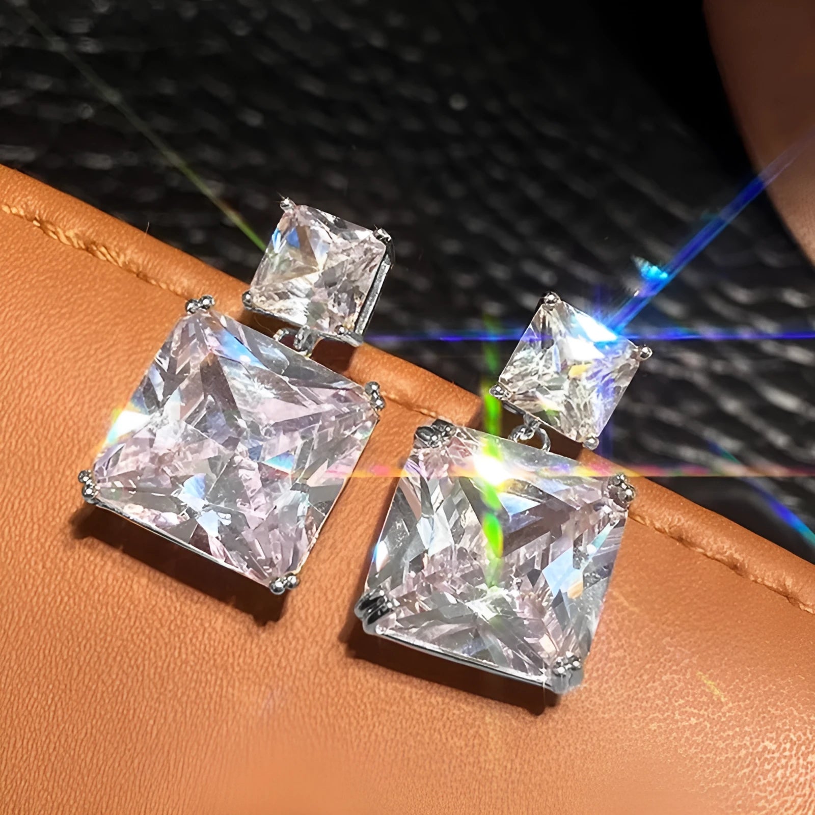 A pair of geometric square design earrings for women in a gold colour finish, made from copper.