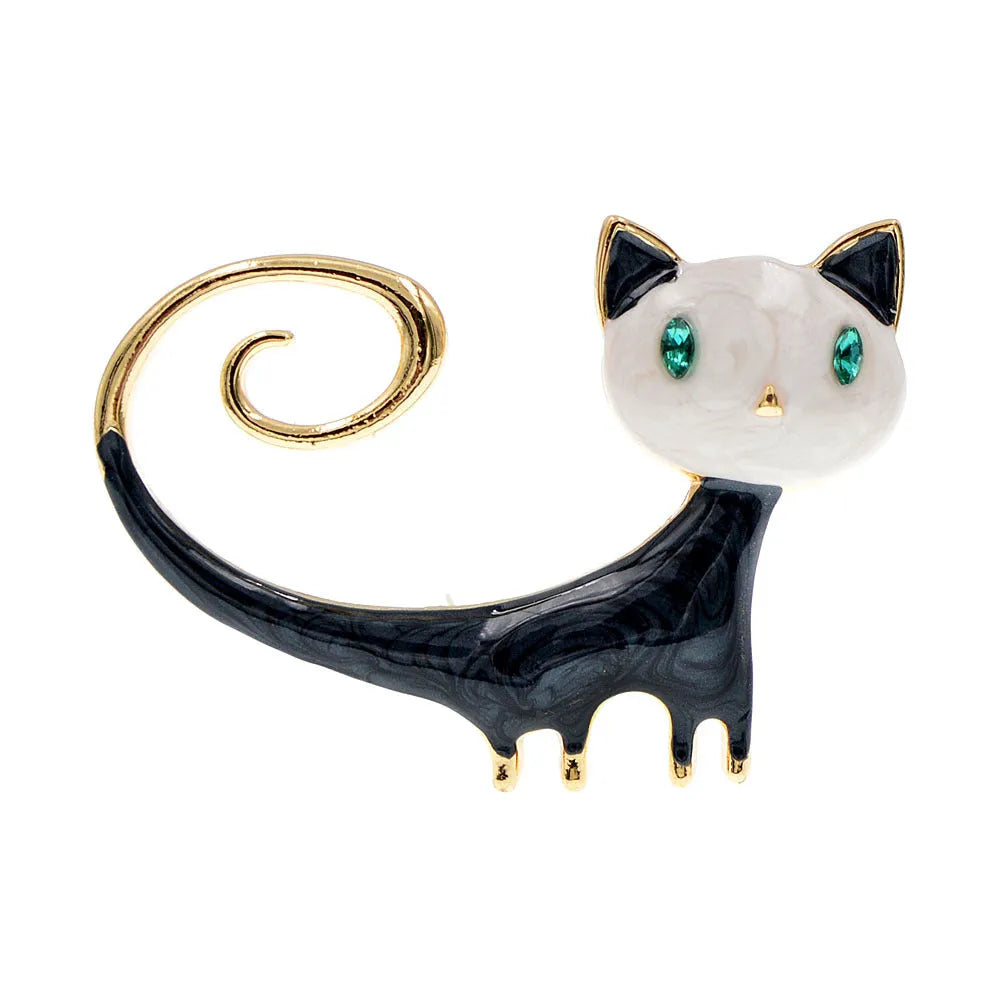 Close-up of a white painted cat tail brooch made from alloy metal.
