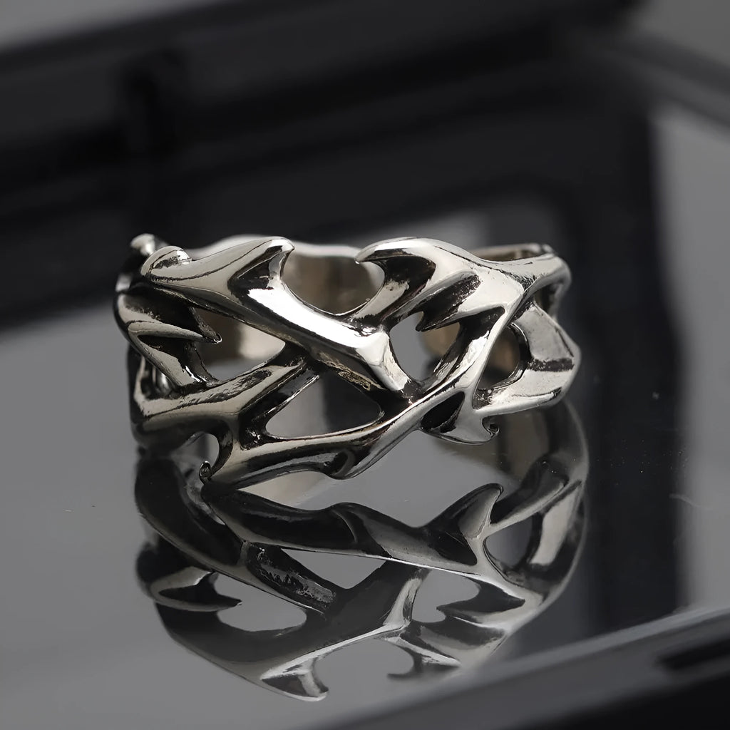 Adjustable copper men's ring with geometric thorn and flower design showing opening mechanism