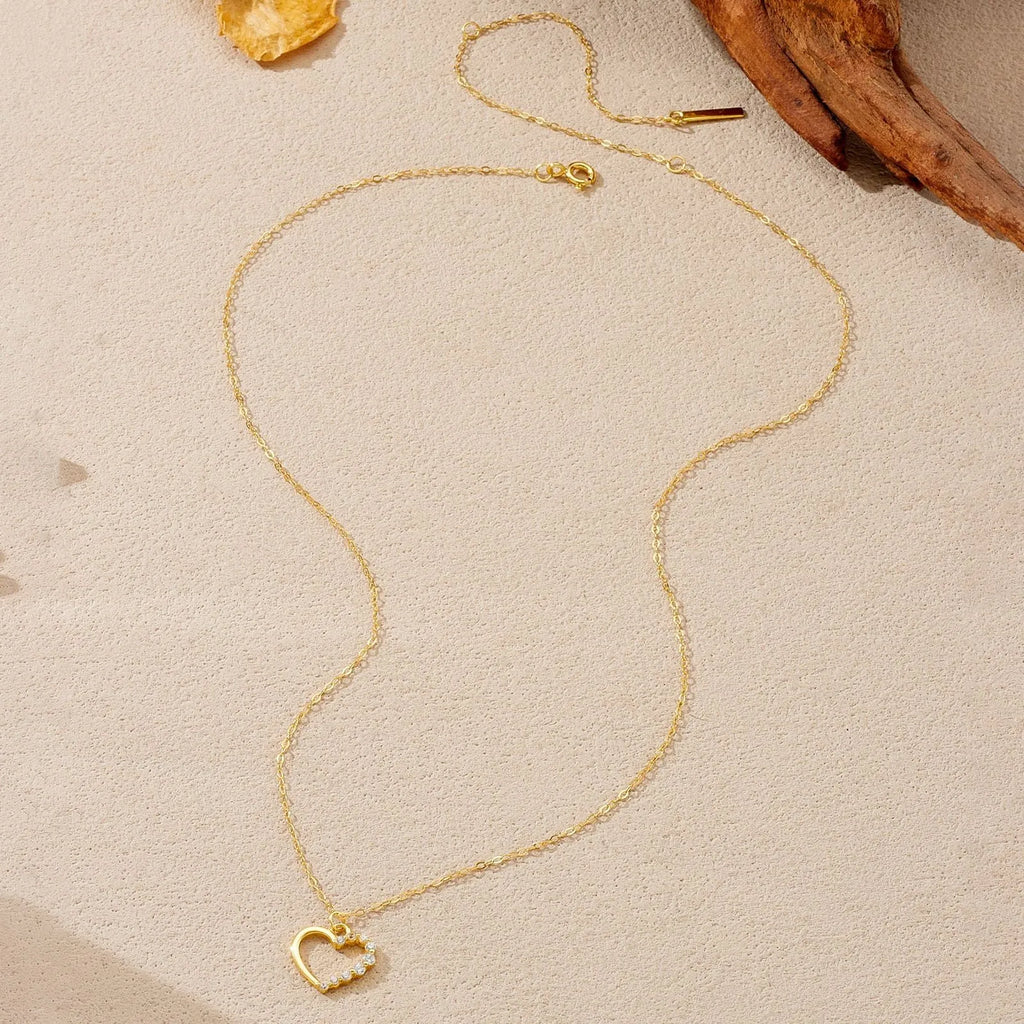 S925 sterling silver hollow heart necklace on a regular chain, shown in gold and platinum finish options.