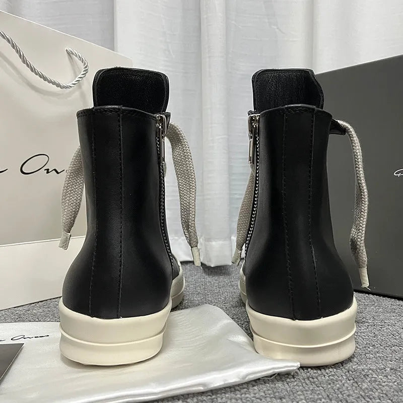 Black genuine leather high-top sneakers with side zipper and round toe on a rubber platform sole.