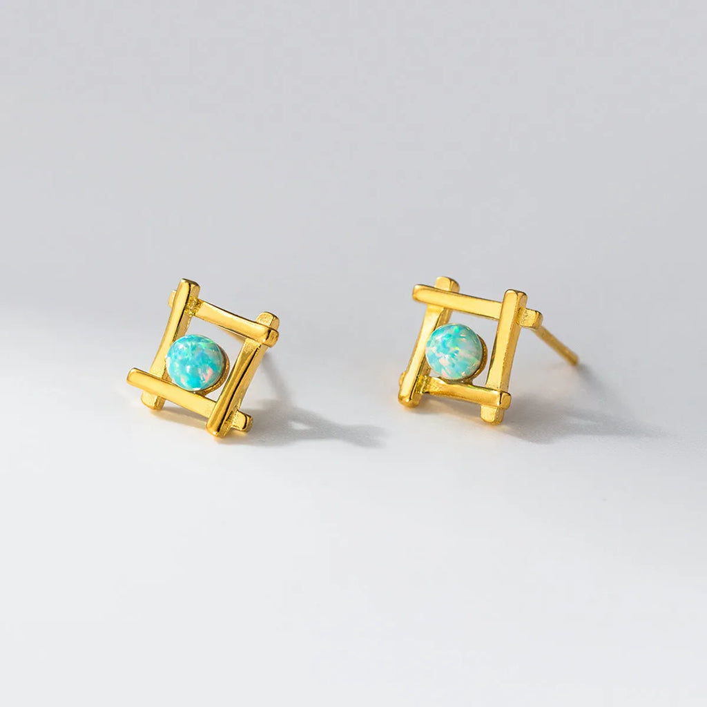 Geometric cross stud earrings in sterling silver with gold or silver plating options