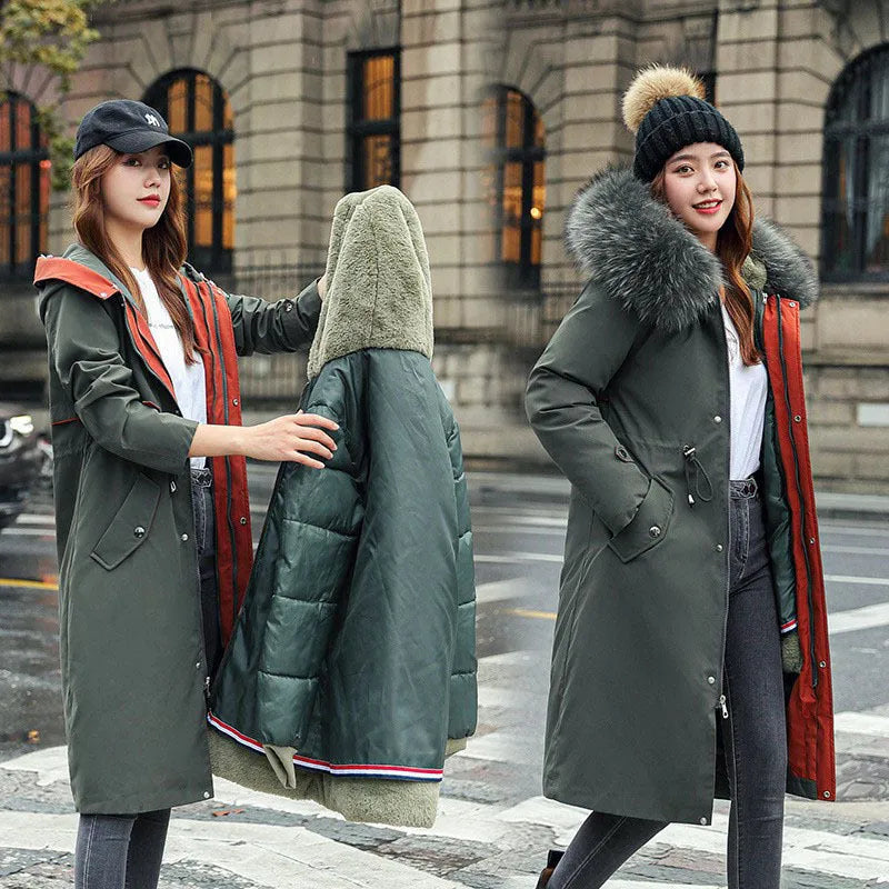 Women's long beige fleece trench coat with a belt, shown on a model.