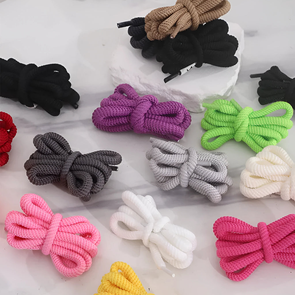 A selection of round braided shoelaces and hoodie cords in various colours, showing 1.0cm width