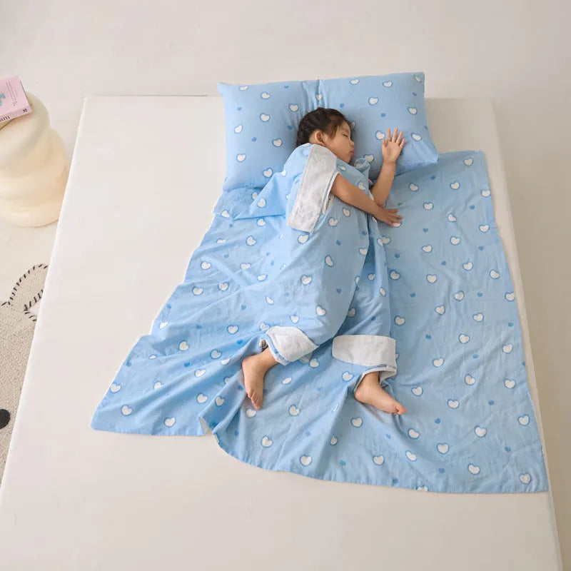 Anti-kick sleeping bag blanket in a summer design on a bed, showing its lightweight texture.