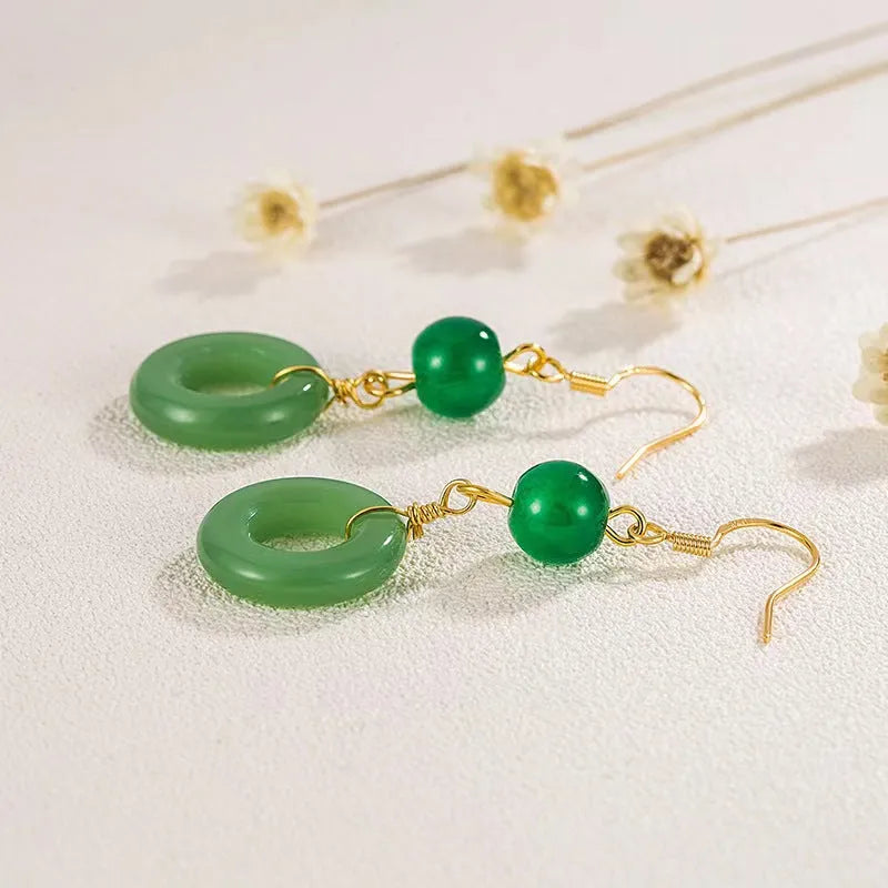 Green jade design peace buckle earrings with 14K gold plating on zinc alloy