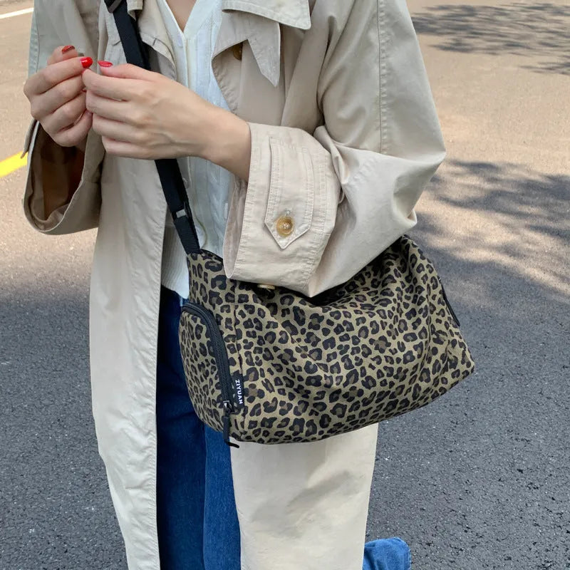 Large capacity leopard print cross-body messenger bag with shoulder strap