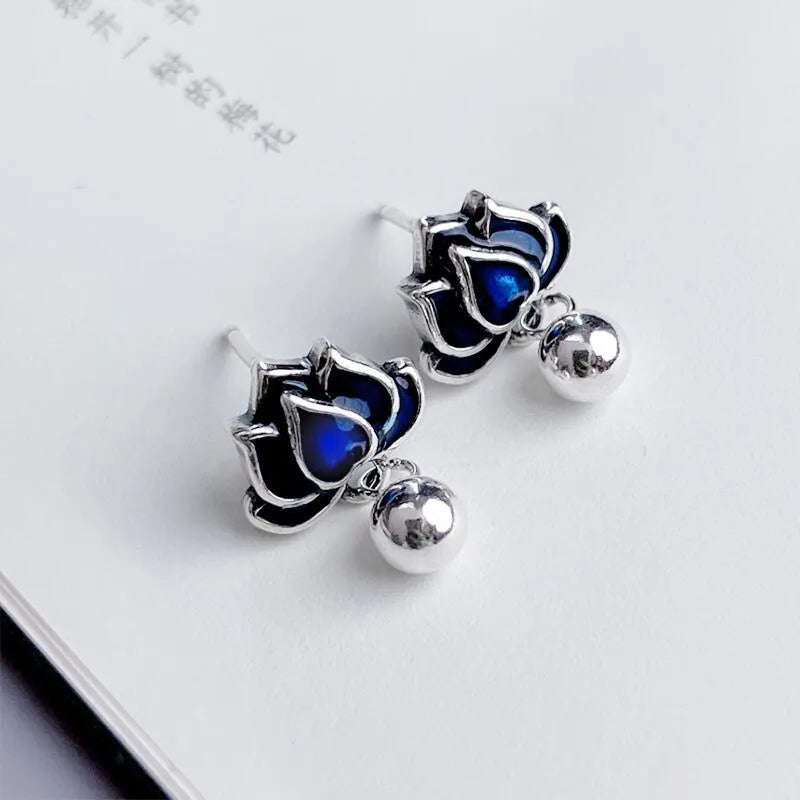 Blue lotus flower ear studs with seedpod tassels measuring 1.2cm wide