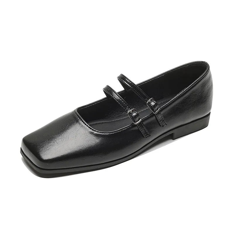 Women's silver genuine leather Mary Jane flats with a cross buckle strap and round toe.