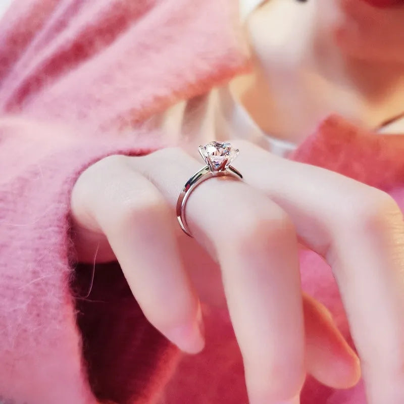White gold plated zircon ring with six-claw geometric setting on white copper base