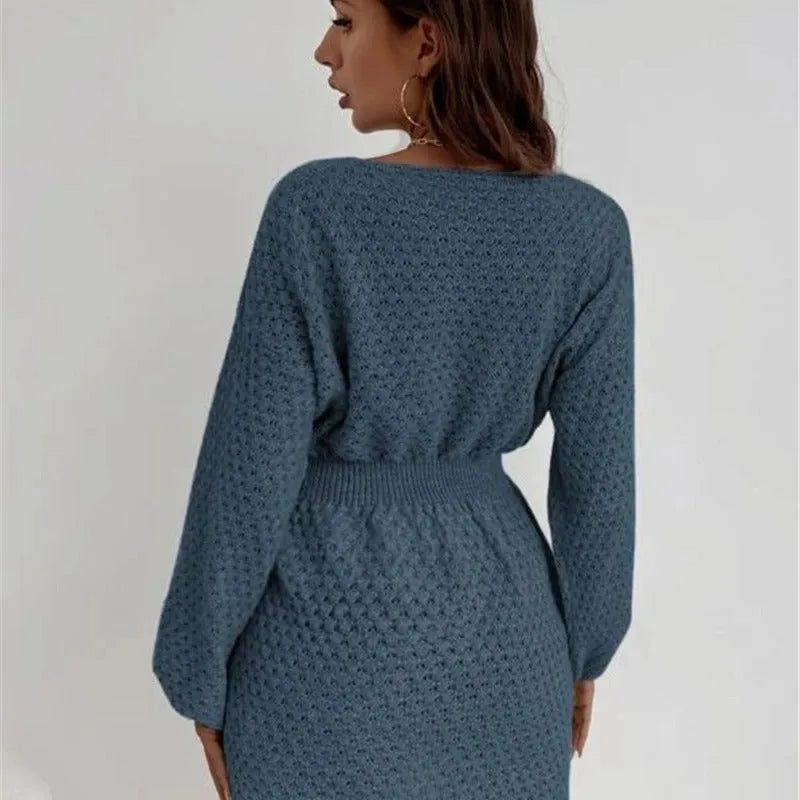 Blue women's knitted dress with French round neck, fitted waist, and crocheted flower details
