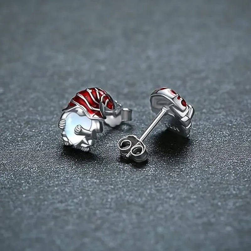 Close-up of women's heart-shaped earrings with a Santa Claus design in a white gold colour.