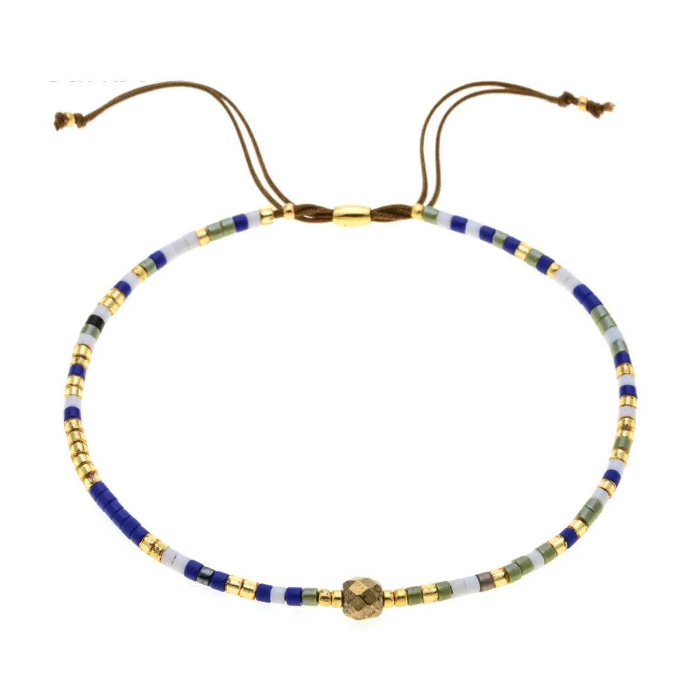 Women's handmade colourful beaded bracelet with geometric glass beads on adjustable cord