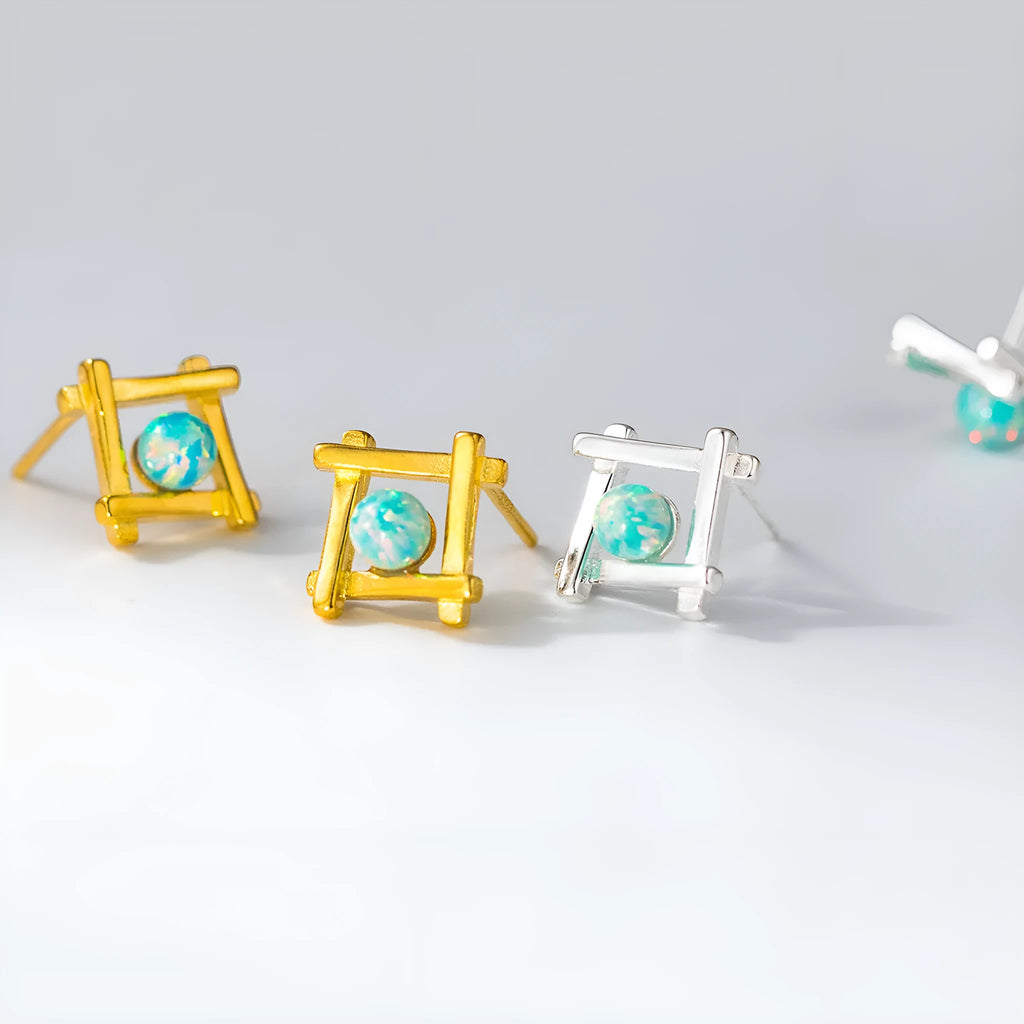Geometric cross stud earrings in sterling silver with gold or silver plating options