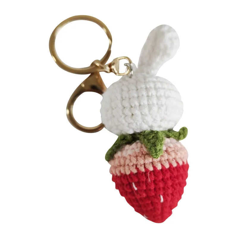 White hand-woven rabbit strawberry pendant on key with cartoon-style wire construction