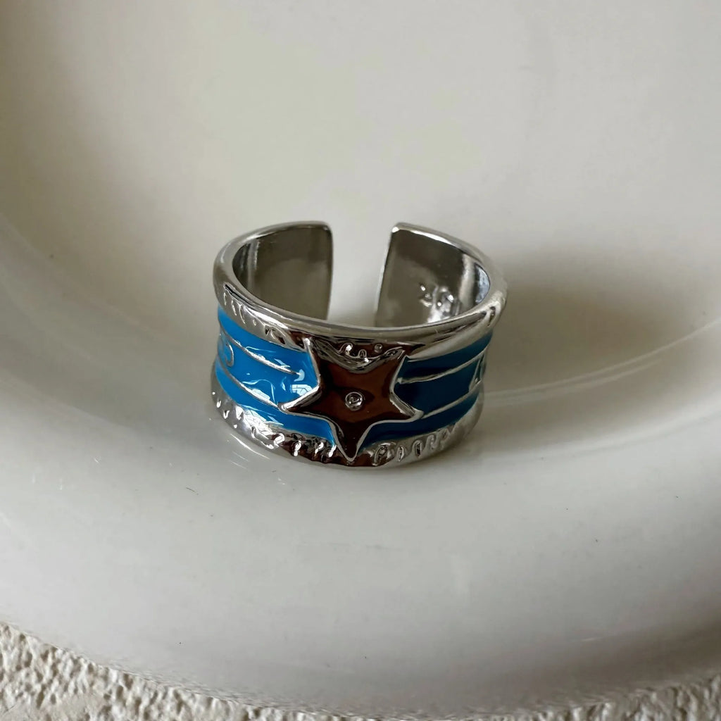 Geometric drop ring with distressed finish and adjustable band